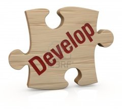12519881-one-wooden-puzzle-piece-with-the-word-develop-3d-render